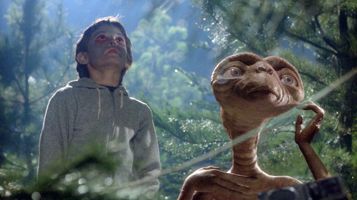 Elliott (HENRY THOMAS) tries to help E.T. phone home.